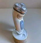 Norelco Quadra Action Shaver Razor 7865XL Cordless W/trimmer, Base And Charger. Fixed Price $49.40.