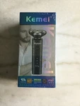 Kemei Rechargeable Shaver KM-T87 Floating Blades, Wet And Dry Use, New Sealed. Fixed Price $20.00.