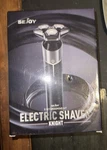 Sejoy Men's Electric Shaver Rechargeable Rotary Trimmer 5 1 Grooming Kit. Fixed Price $27.99.