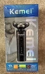 Kemei Rechargable Shaver KM-T87, Floating Blades, Wet/dry Use, New. Fixed Price $18.57.